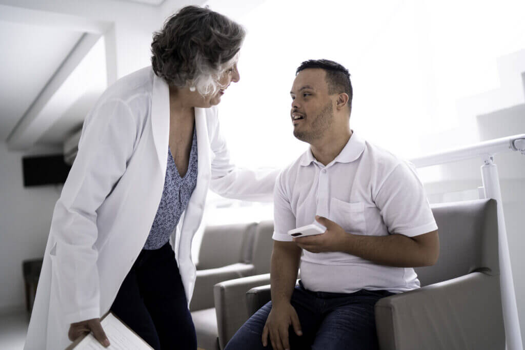 Doctor and patient with Down syndrome